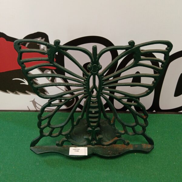 Vintage cast iron butterfly recipe book stand for kitchen display.