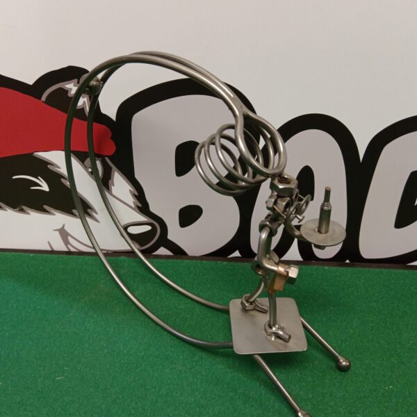 Silver metal wine bottle holder, sculptural welded art piece.