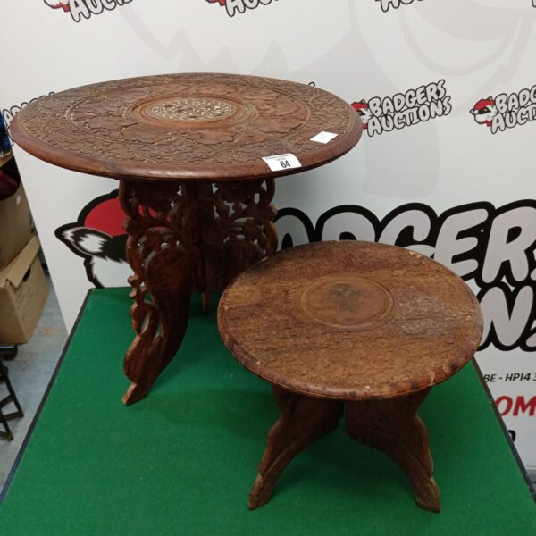 Intricate carved Indian folding table with tripod base.