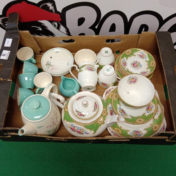 Vintage floral teasets from Crown Ducal and Grafton China on display.