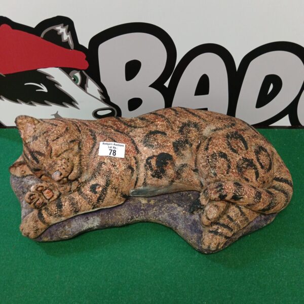 Detailed concrete garden cat ornament for outdoor display.