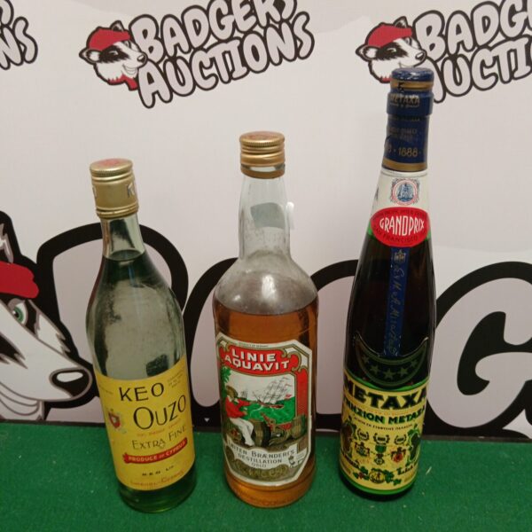 Vintage Metaxa and Keo Ouzo bottles, collectible alcohol.