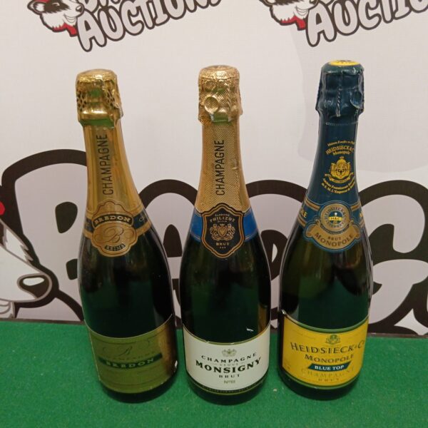 Vintage champagne collection featuring Heidsieck and Monsigny bottles.