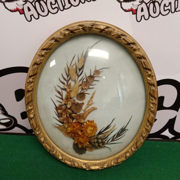 Antique oval frame with dried flower arrangement, vintage botanical art.