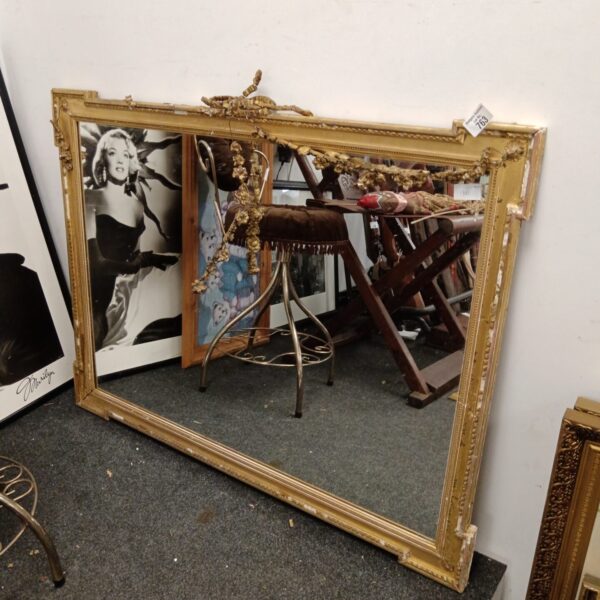 Ornate antique gilt jesso mirror awaiting restoration.