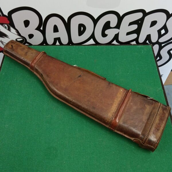 Vintage leather shotgun case with classic shoulder of mutton shape.