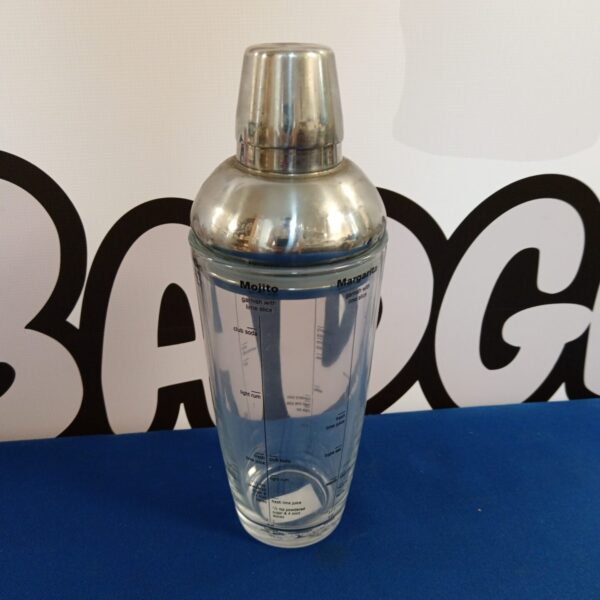 Stainless steel cocktail shaker with printed cocktail recipes.