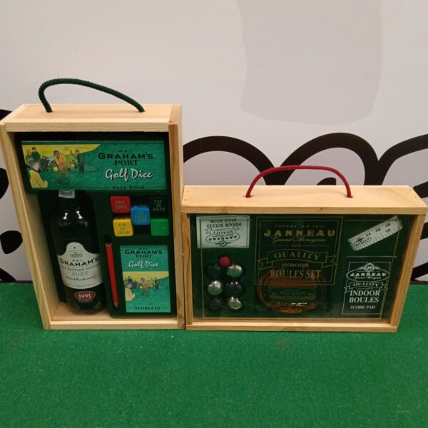Vintage Graham's Port golf dice set and Janneau indoor boules set on display.