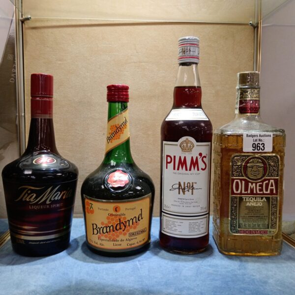 Vintage alcohol lot including Olmec Tequila and Pimm's.