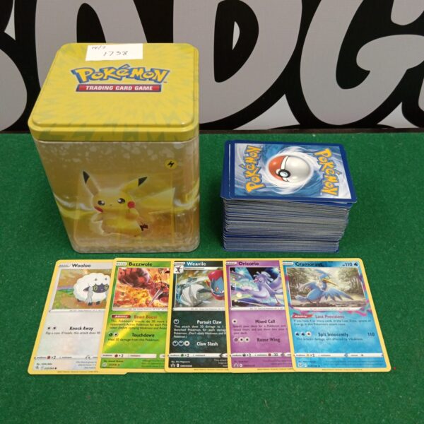 Pokémon card tin with holographic cards inside.