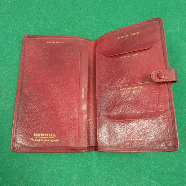 Vintage red leather Dunhill wallet with travel compartments.