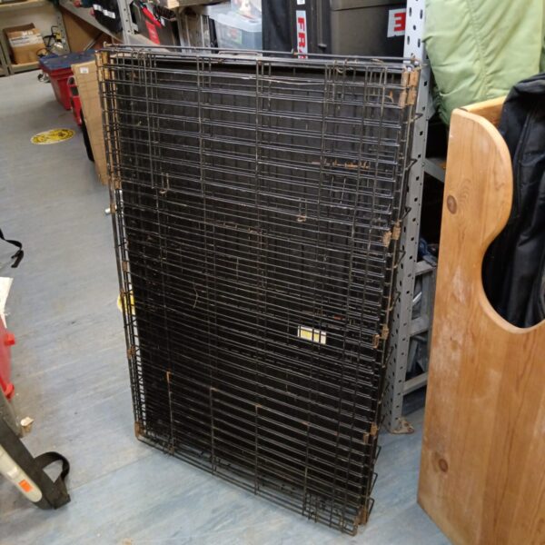 Large folding dog cage made of metal wire for pet containment.
