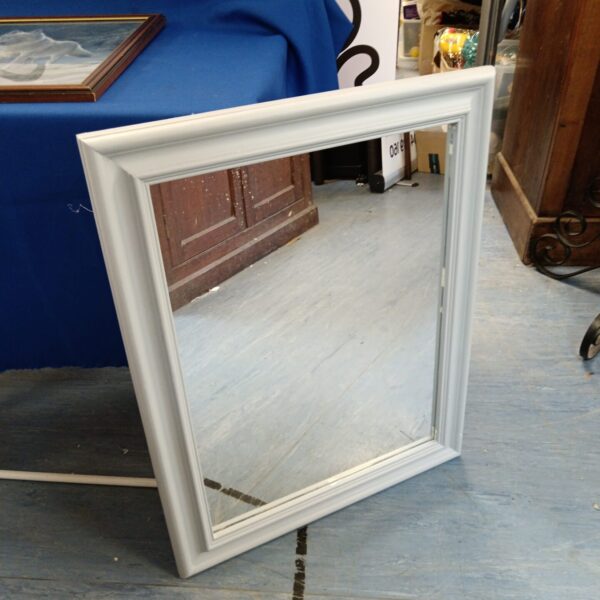 Grey framed rectangular mirror for home decor.