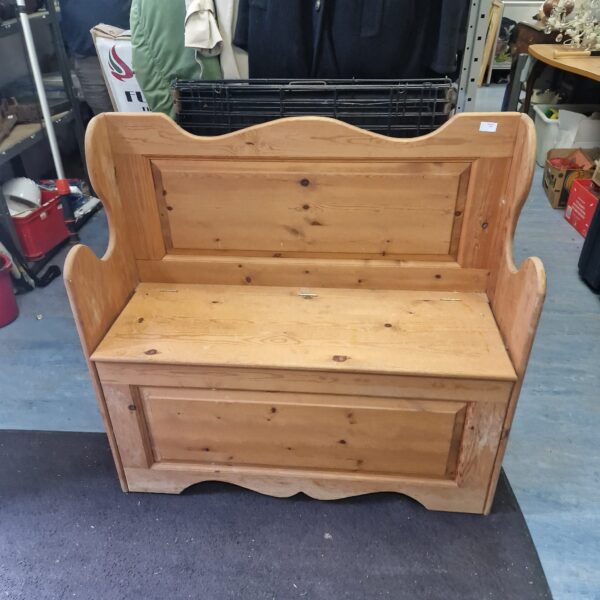 Rustic pine monks bench with lift-up storage for hallway or kitchen.
