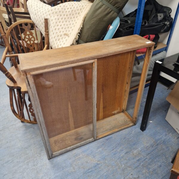 Vintage wooden notice board for wall mounting, showing wear.