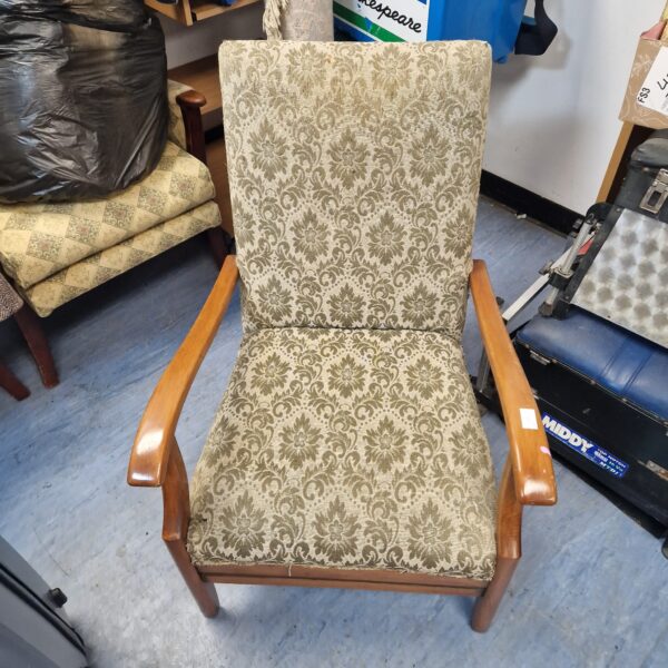 Green floral patterned vintage armchair, mid century style.