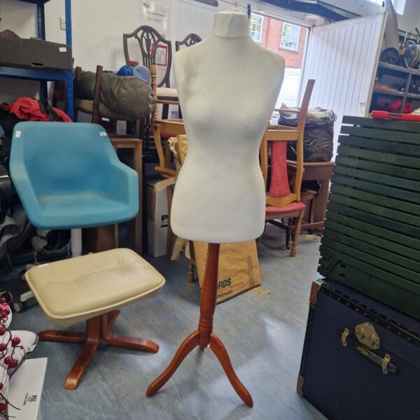 Vintage dress form mannequin with wooden tripod base.