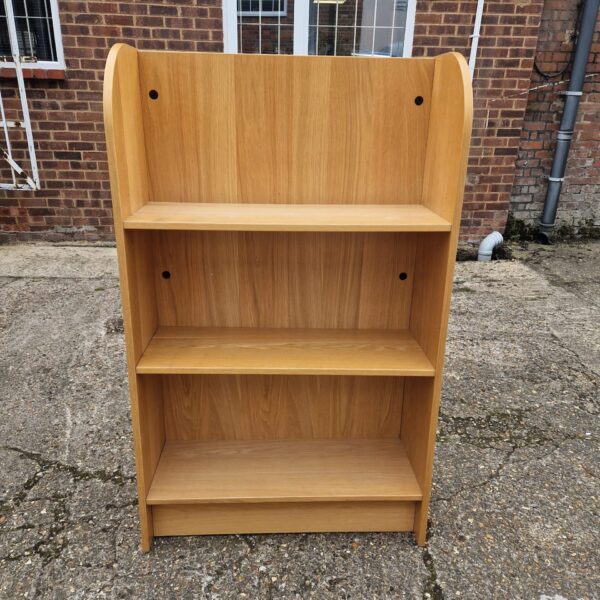 Small oak effect bookshelf for home storage and display.