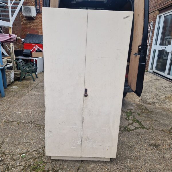 Front view of a vintage painted wardrobe with two doors.