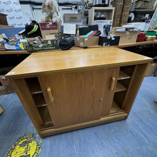 Vintage oak office cabinet with signs of wear and use.