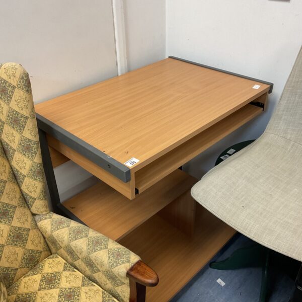 Beech effect computer desk with keyboard tray and shelf.