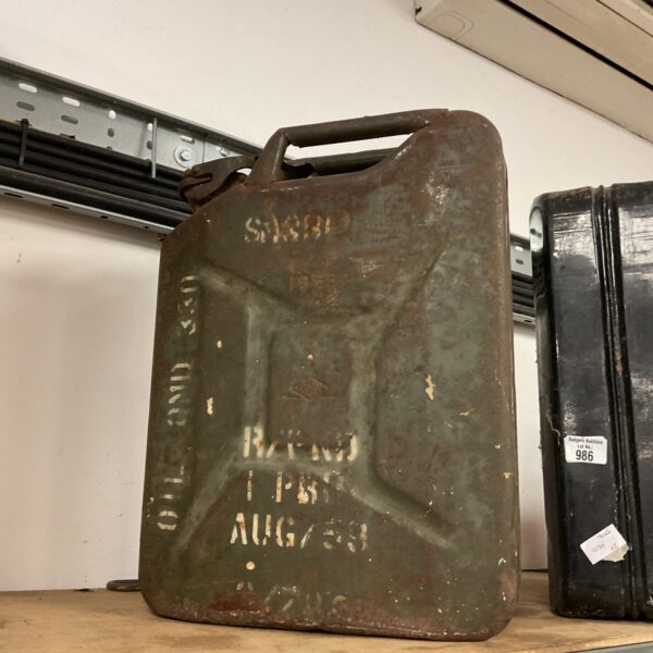 Vintage 1953 US military jerry can with visible wear.