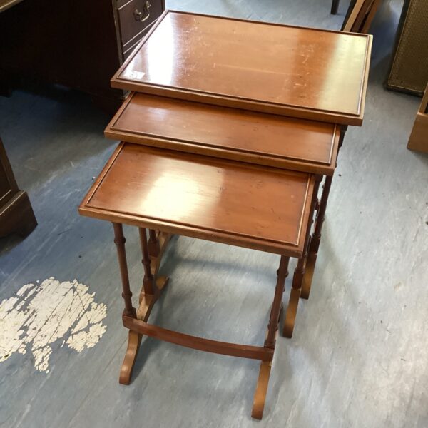 Vintage walnut nest of tables with curved legs.