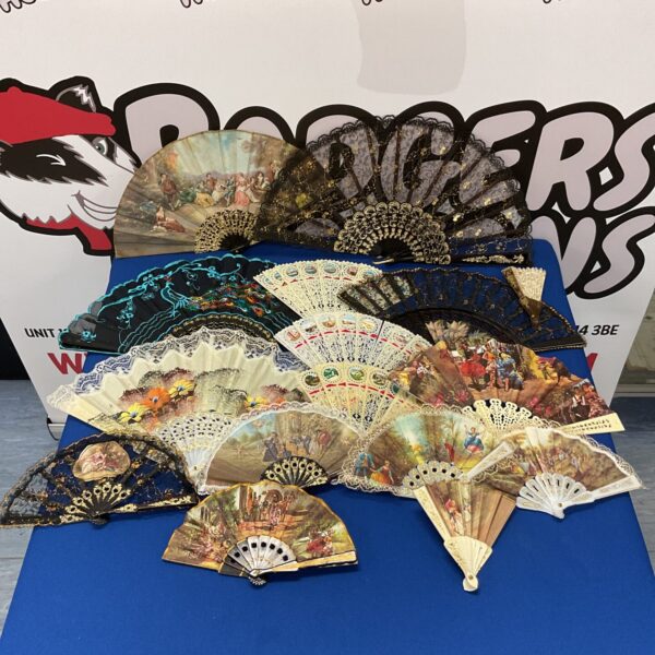 Vintage hand fan collection with painted designs.