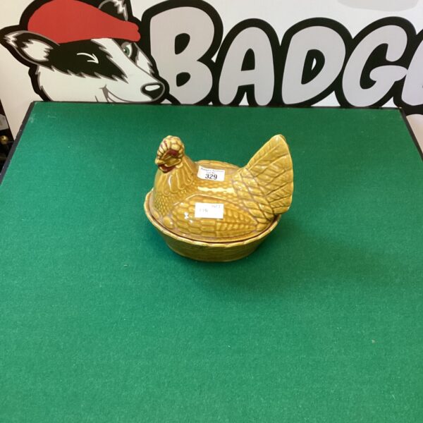 Vintage pottery chicken egg holder for farmhouse kitchen decor.