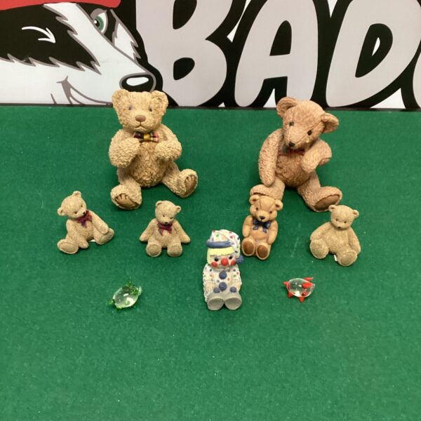 Close-up of pottery teddy bears and figurines.
