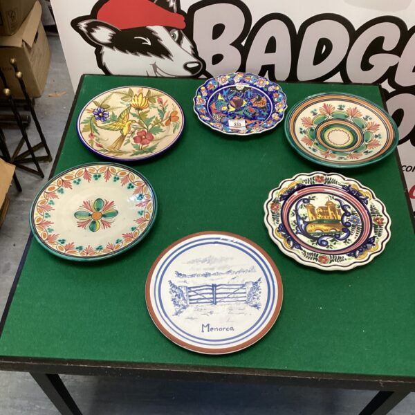 Lot of colourful decorative wall plates for vintage home decor.