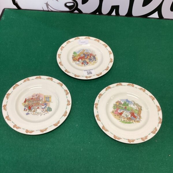 Three vintage Royal Doulton Bunnykins plates with character scenes.