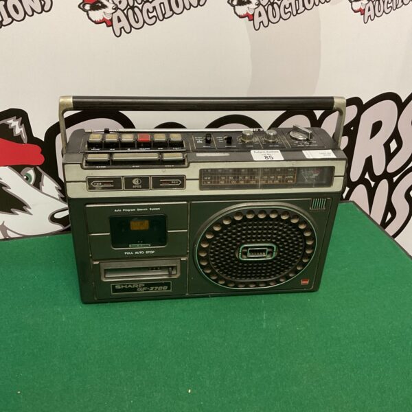 Vintage Sharp GF-3700 boombox radio and cassette player, side view.