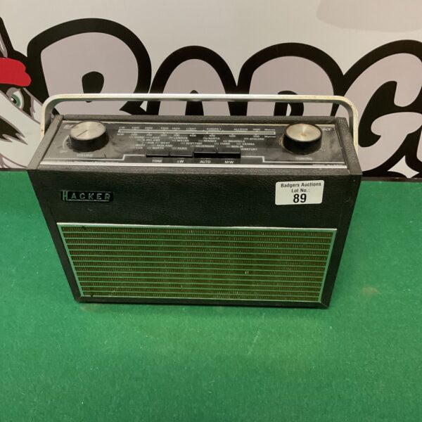 Front view of a vintage Hacker Autocrat portable radio.