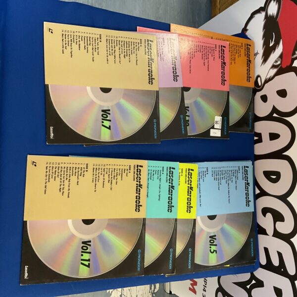 Lot of vintage Laser Karaoke disks for sing-along entertainment.