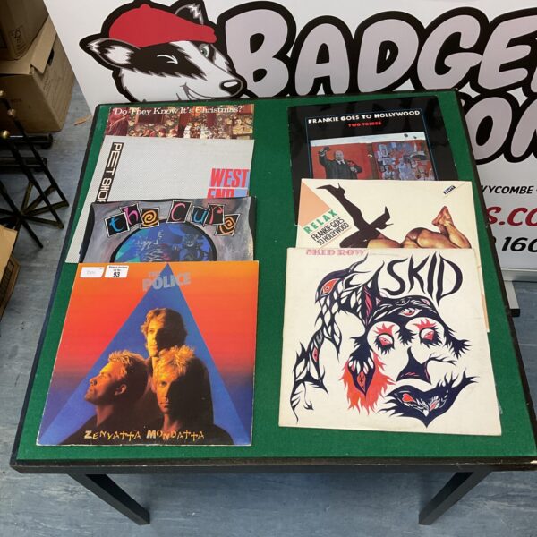 Vintage vinyl record collection featuring The Police, The Cure, and Frankie Goes to Hollywood.