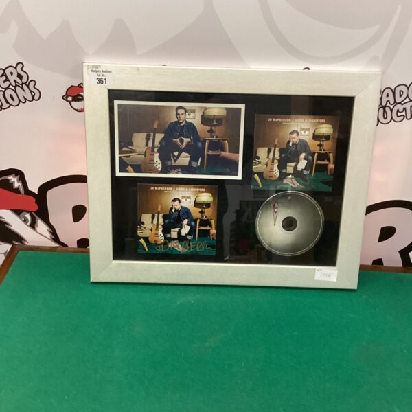 Framed JD McPherson signed photo and disc, rockabilly music memorabilia.