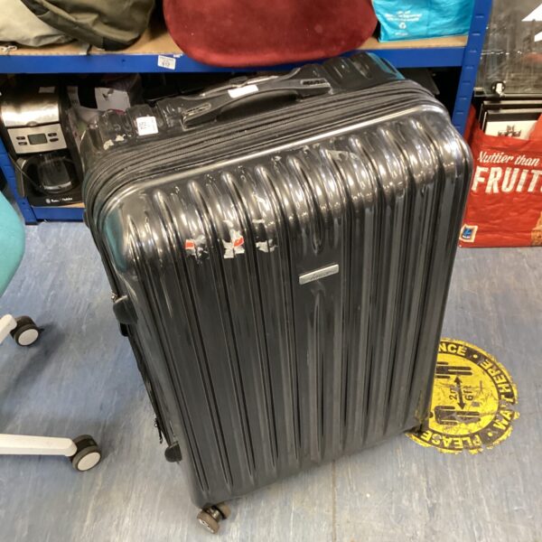 Black Linea wheeled suitcase with castors, ready for travel.