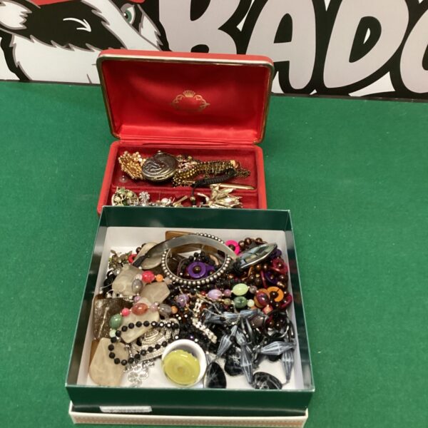 Vintage costume jewellery lot with necklaces and brooches.