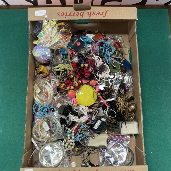 Assorted jewellery lot with necklaces and rings on display.