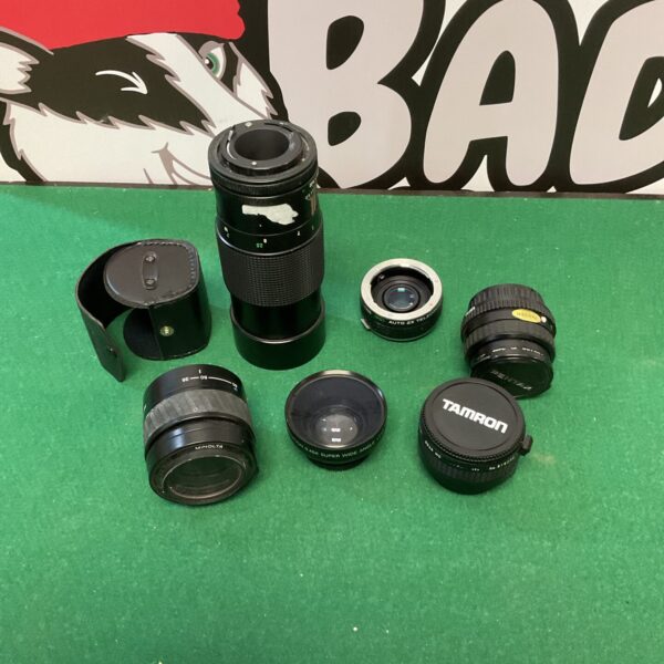 Collection of vintage camera lenses including Vivitar and Pentax.