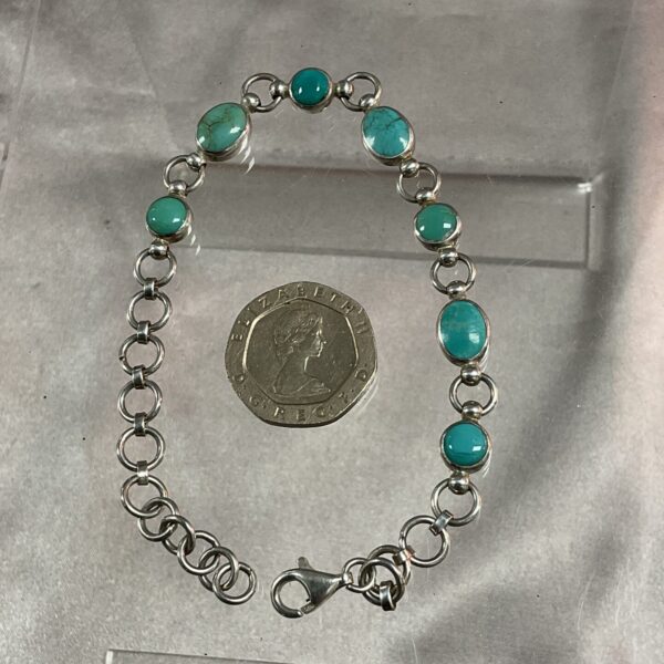 Vintage silver and turquoise bracelet with adjustable links.