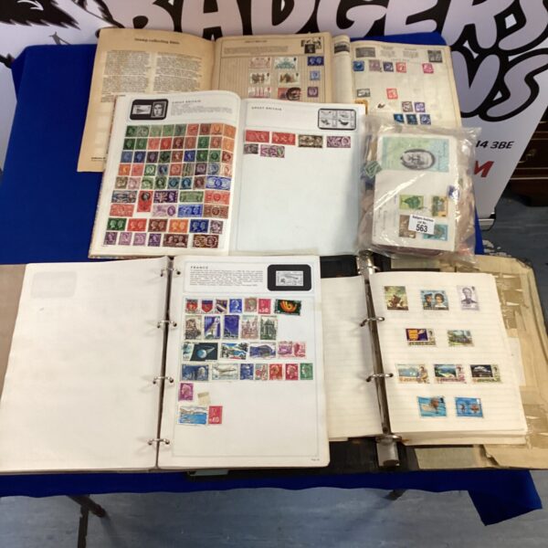 Vintage stamp albums and loose stamps for collectors.