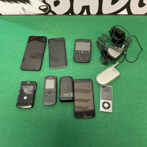 Vintage mobile phone lot including Samsung, Nokia, Blackberry and Apple devices.