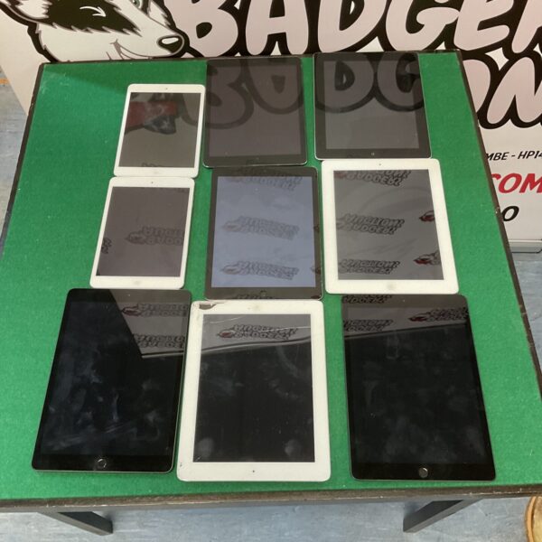 Group of nine used Apple tablets for parts or repair.