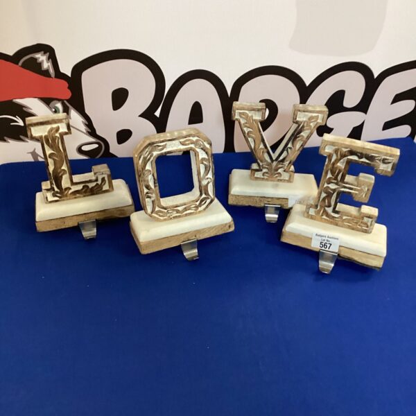 Vintage love table hooks with marble base for wall mounting.
