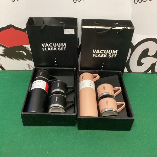 Vintage his and hers vacuum flask sets in white, red and blue.