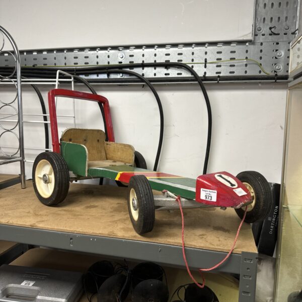 Vintage wooden go kart, a charming retro child’s toy.