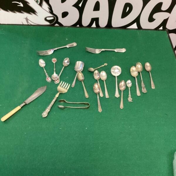 Vintage silverplate cutlery lot with assorted forks and spoons.