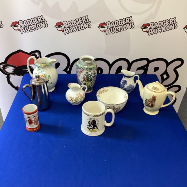 Antique china and porcelain collection featuring vintage jugs and vases.